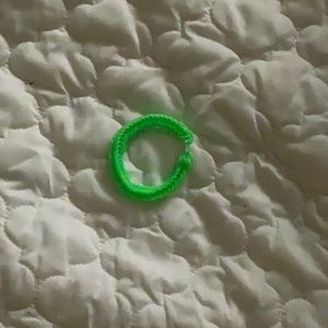 this is a handmade ,neon green,rubber band bracelet and is very stretchy.